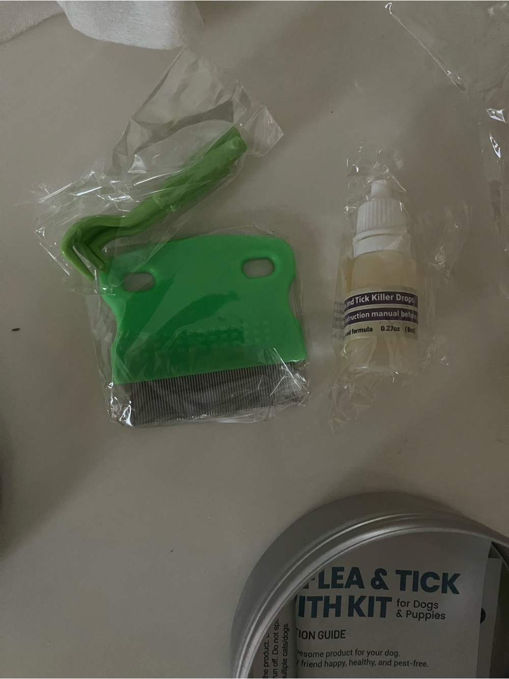 Flee & tick drops, comb and tool
